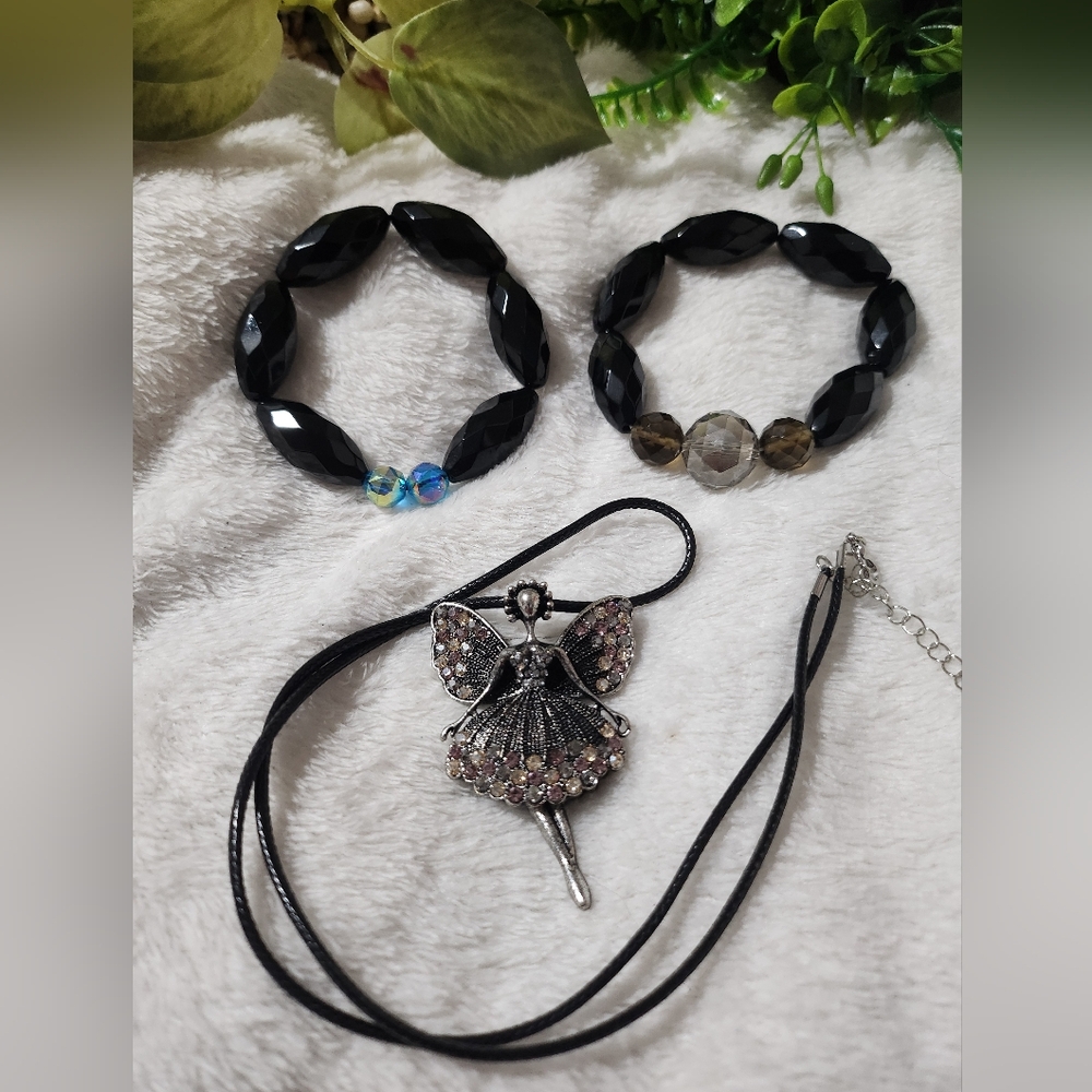 Handmade beaded bracelets with Fairy pendant.